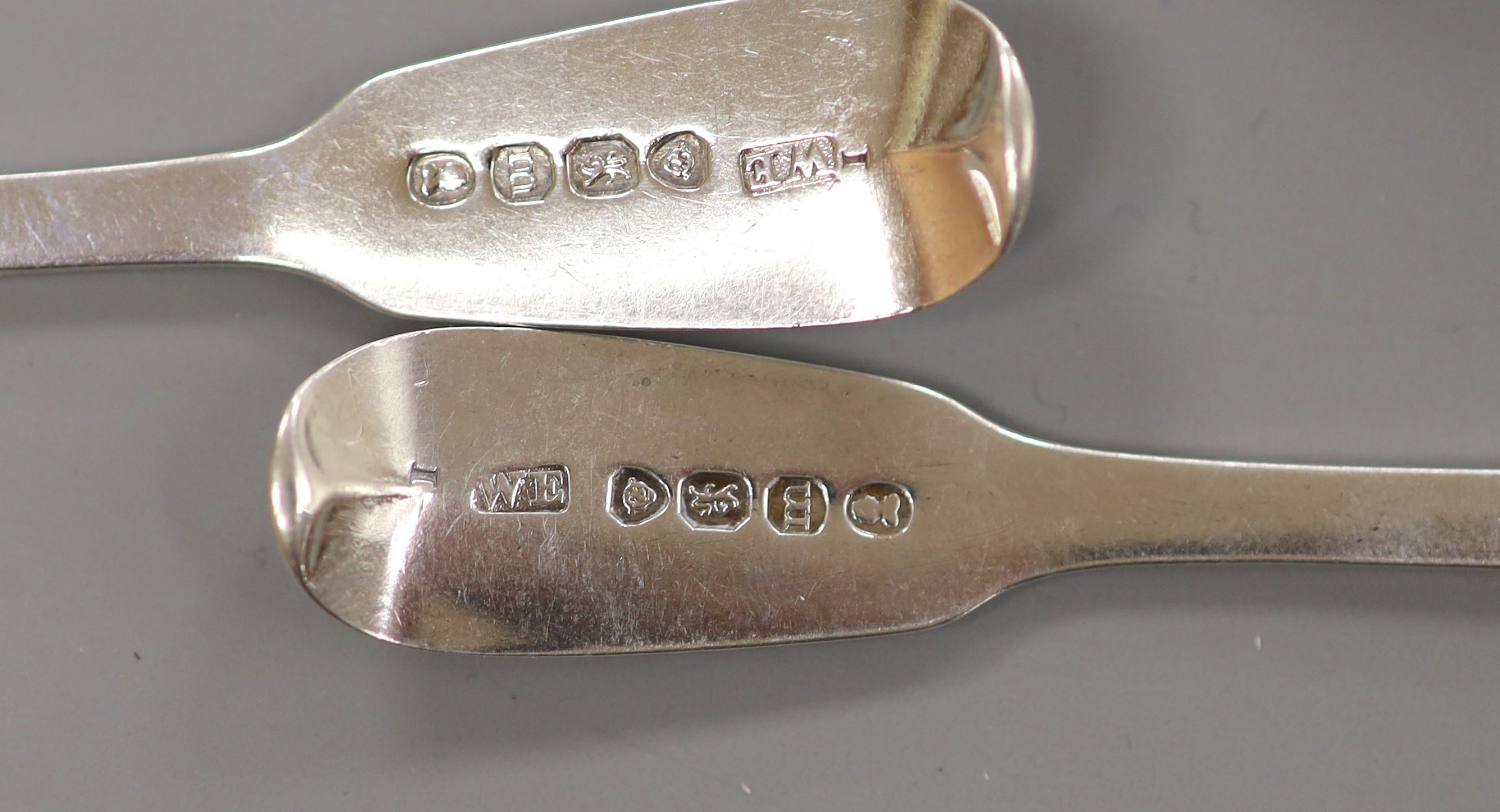 A George III Irish bright cut engraved silver tablespoon, John Shiels, Dublin, 1765 and two Victorian silver mustard spoons, 83 grams.